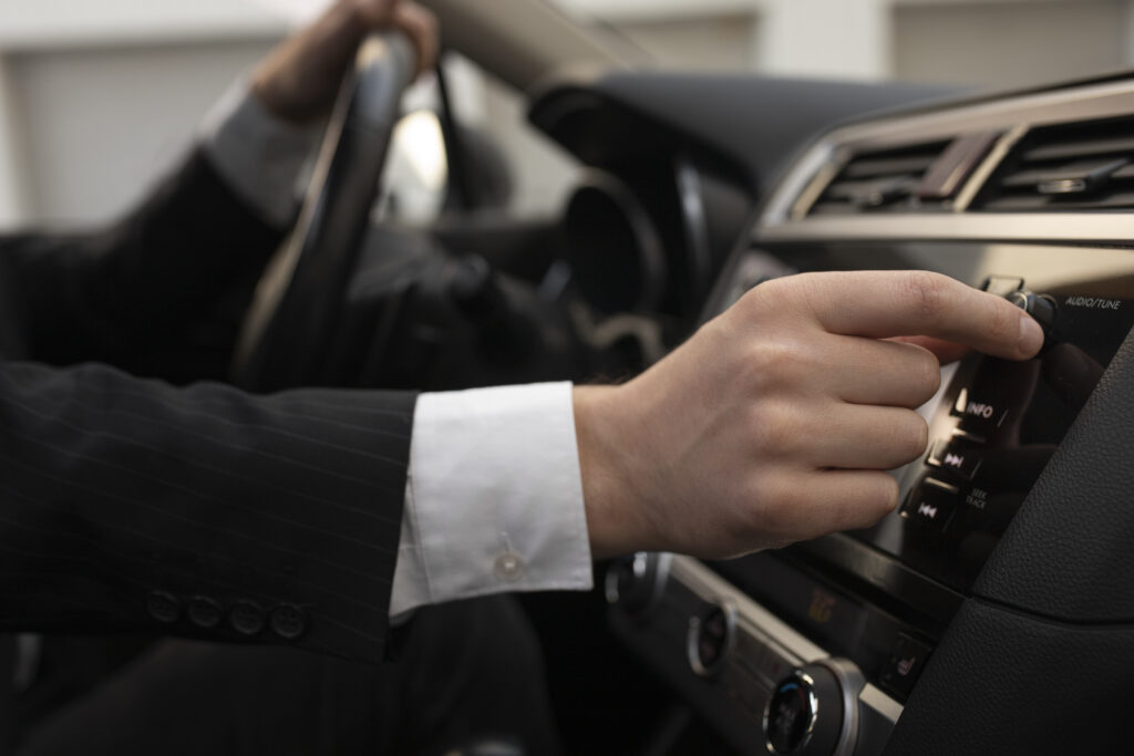 man using his car s options while driving