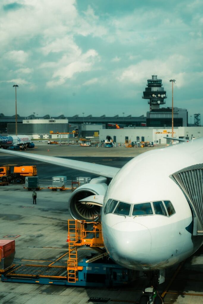 pexels photo 34710731 Front view of a commercial airplane at Hong Kong International Airport's terminal.